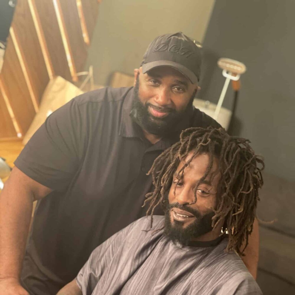 Darryl Poses With Artist At Photoshoot