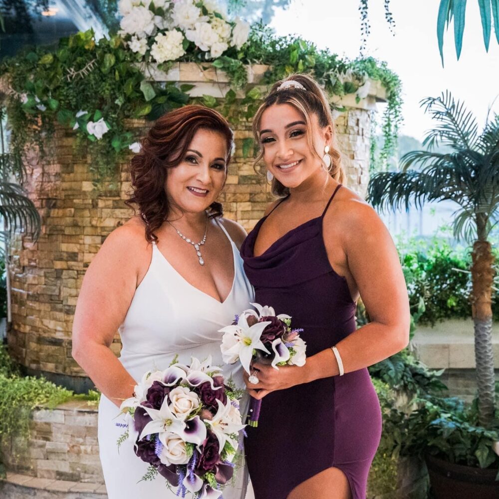 Bride And Maid Of Honor Pose Together